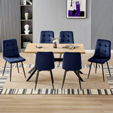 Chaise de salle à manger bleu marine en velours hollandais avec pieds en métal.