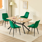 Chaise de salle à manger verte avec revêtement en velours et pieds en métal.