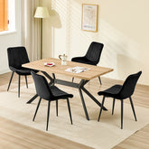 Chaise de salle à manger noir avec revêtement en velours et pieds en métal.