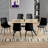 Chaise de salle à manger noir en velours hollandais avec pieds en métal.