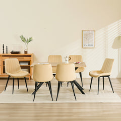 Chaise de salle à manger Champagne avec revêtement en velours et pieds en métal.