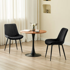 Chaise de salle à manger noir avec revêtement en velours et pieds en métal.